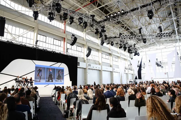 Fashion Tech Forum stage and seated audience in a warehouse